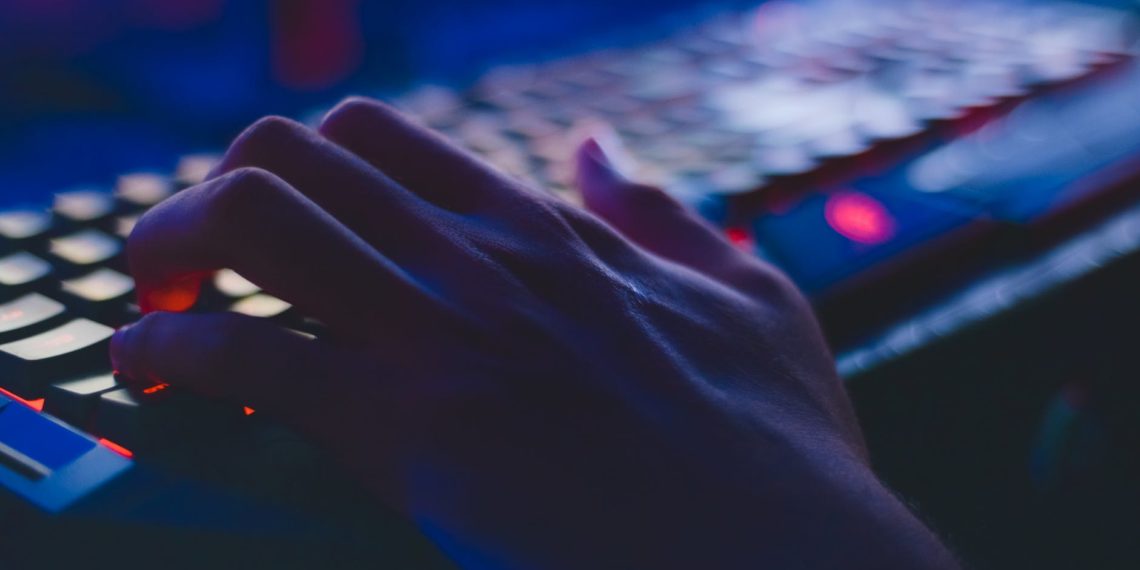 photo of person typing on computer keyboard